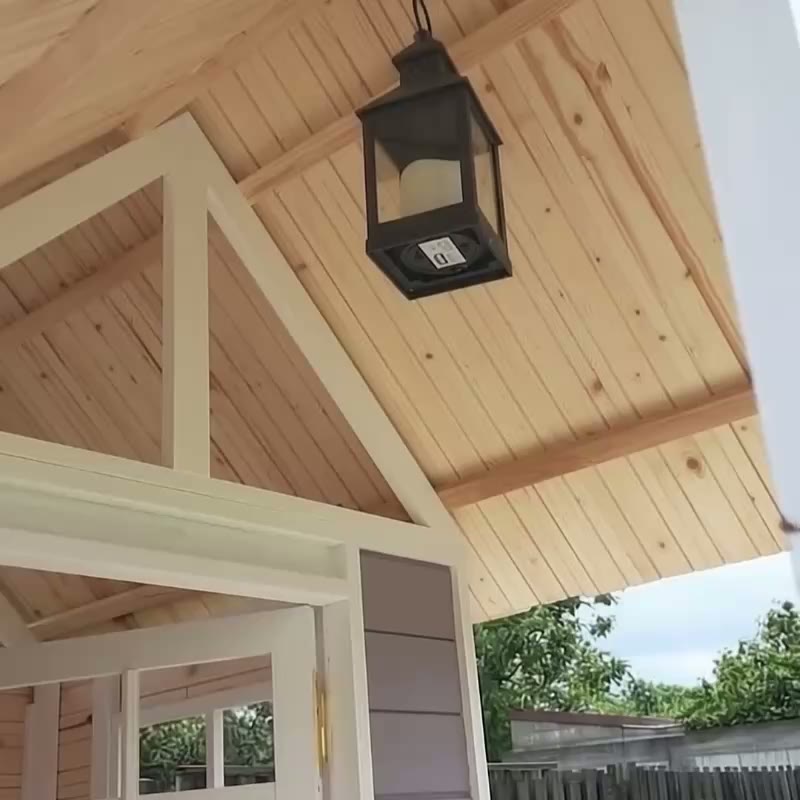 Timber-lined porch ceiling and hanging lantern at the Lilac Lookout